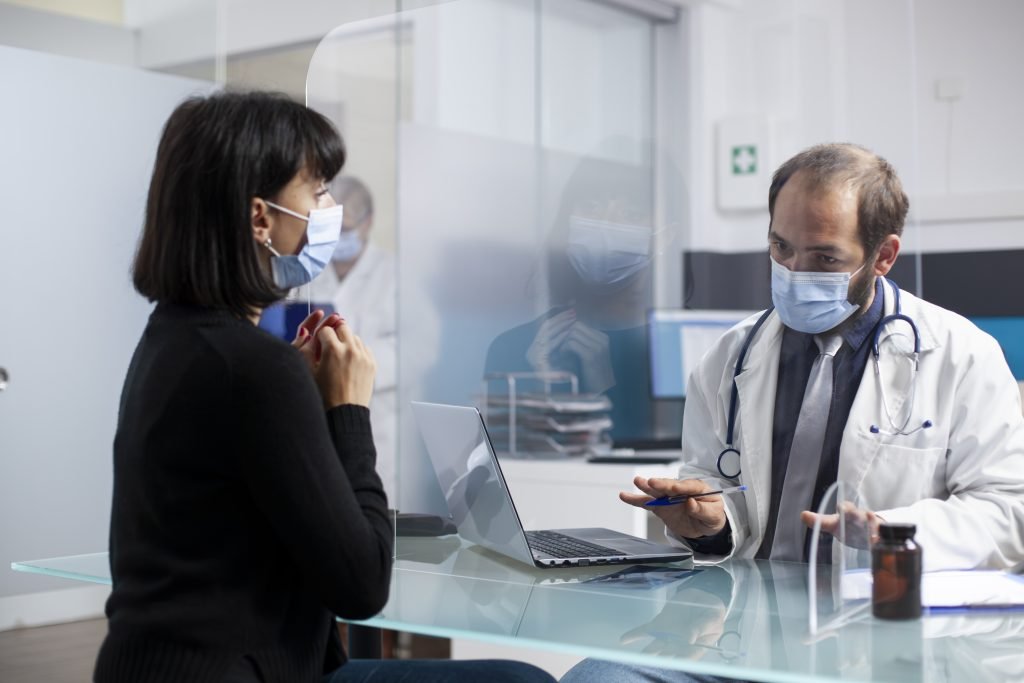 Doctor consulting with a patient in clinic